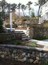 Stone wall in front of the house